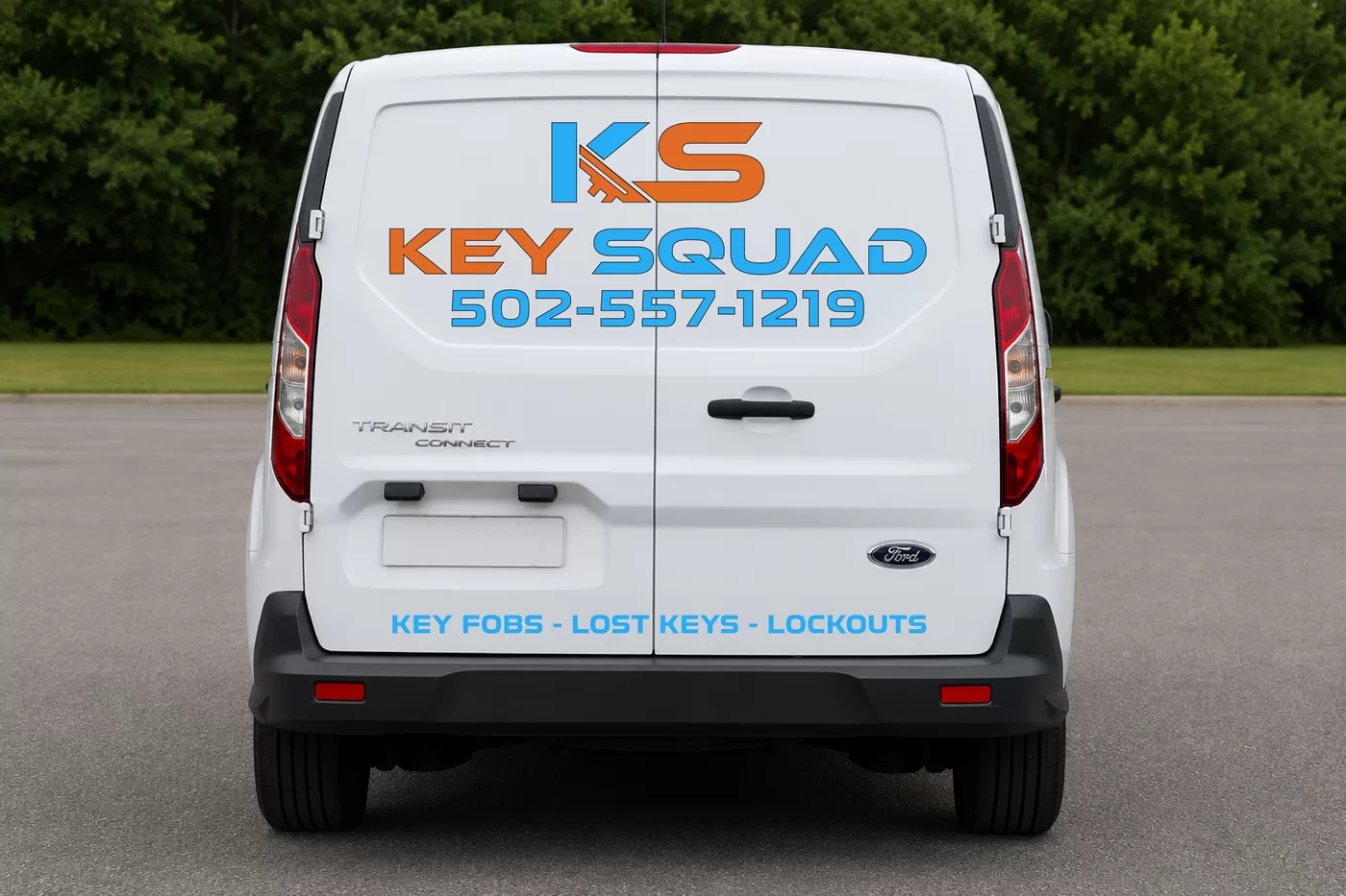 The Key Squad service van from behind, the company name, phone number, and services lettered across the rear doors.