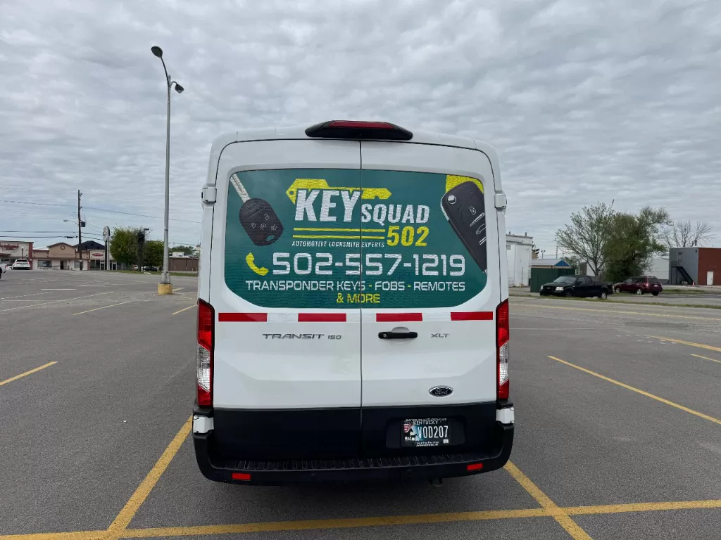 The Key Squad service van parked in a Louisville lot with the company name and phone number on the rear wrap.